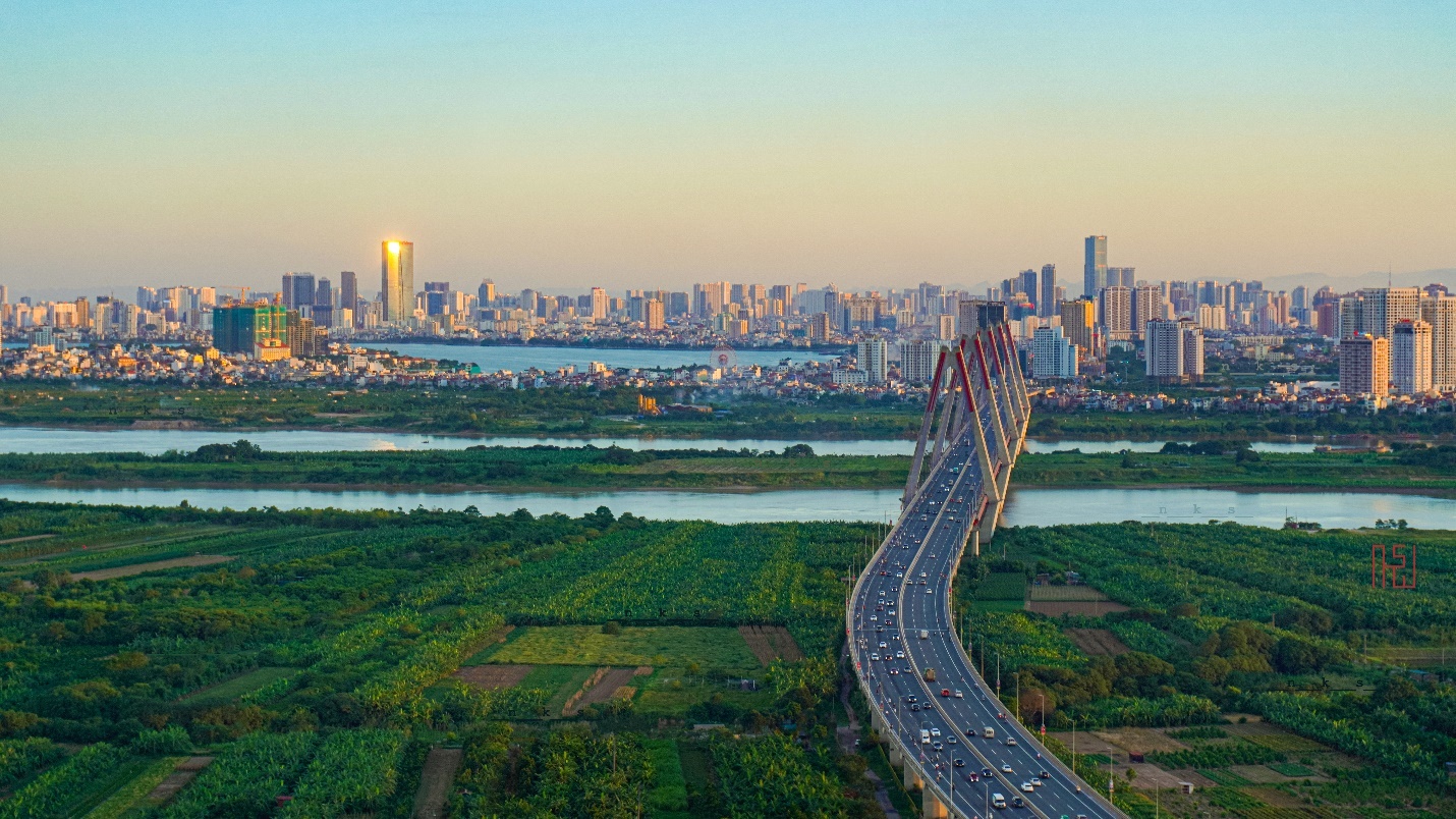 Photo of a bridge from rural area to downtown Hanoi.