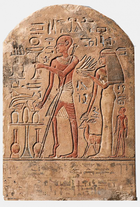 A photo of a tan tablet that is rectangular shaped and rounded at the top. A human figure is facing right with a shaved head and wearing a loin cloth. The figure is hold a long stick and one foot is raised on the toes. Other various shapes and a woman figure are surrounding this human figure.