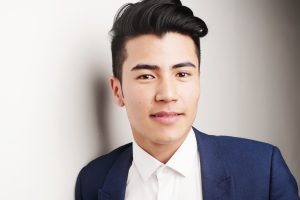 A man with brown hair and brown eyes