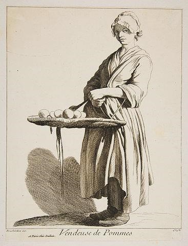 Saleswoman with basket of apples