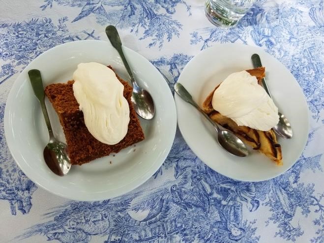 Gingerbread and apple pie, both covered in Chantilly whipped cream