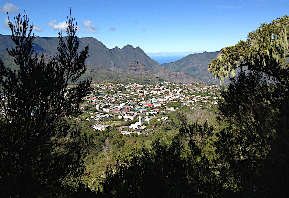 A valley seen from the rocky cliffs above