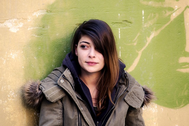 Young woman with medium brown hair wearing coat